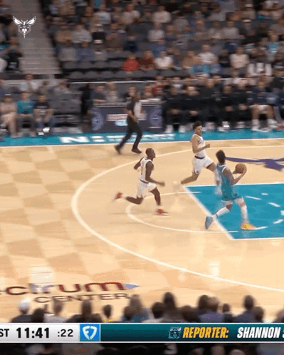 A Basketball Game Is Being Played In Front Of A Large Crowd GIF