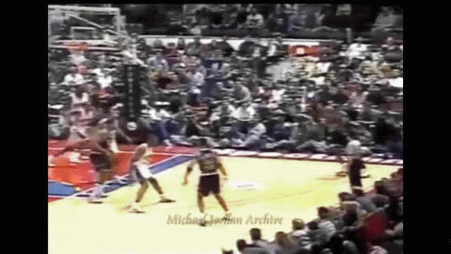 A Basketball Game Is Being Played In Front Of A Michael Jordan Archive Audience GIF