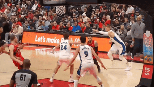 A Basketball Game Is Being Played In Front Of A Sign That Says " Let 'S Make " GIF