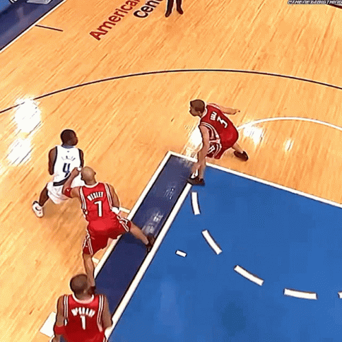 A Basketball Game Is Being Played In The America Center GIF