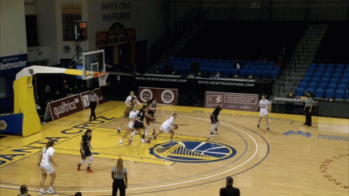 A Basketball Game Is Being Played On A Court Sponsored By Qualtrics GIF