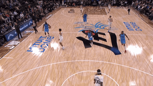 A Basketball Game Is Being Played On A Court That Has The Word Dome Painted On It GIF