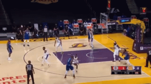 A Basketball Game Is Being Played On A Court That Has The Word Lakers On It GIF