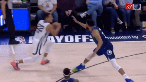 A Basketball Game Is Being Played On A Court That Has The Word Payoffs On It GIF