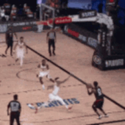 a basketball game is being played on a court that has the word spurs on the floor