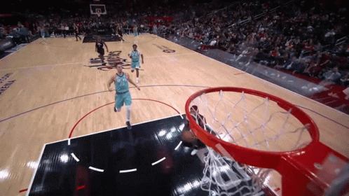 A Basketball Game Is Being Played On A Court That Says Arena GIF