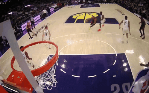 a basketball game is being played on a court that says budweiser