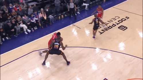 A Basketball Game Is Being Played On A Court That Says Footprint Center GIF
