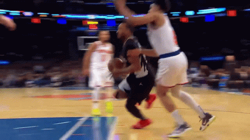 A Basketball Game Is Being Played On A Court With A Blue Line GIF