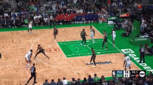 A Basketball Game Is Being Played On A Court With A Coinbase Ad GIF