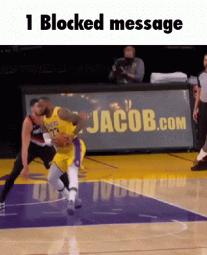A Basketball Game Is Being Played On A Court With A Jacob.com Banner In The Background GIF