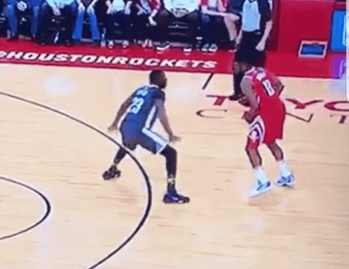 A Basketball Game Is Being Played On A Court With A Sign That Says Houston Rockets On It GIF