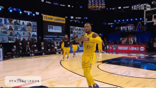 a basketball game is being played on a court with a sign that says team lebron