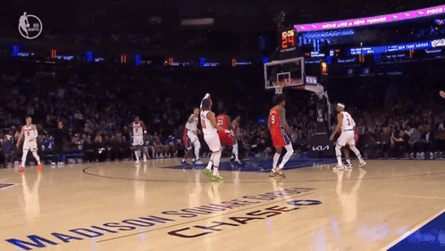 A Basketball Game Is Being Played On A Madison Square Garden Court GIF