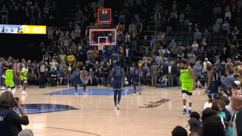 A Basketball Game Is Being Played With A Crowd Watching And The Score Is 0-0 GIF