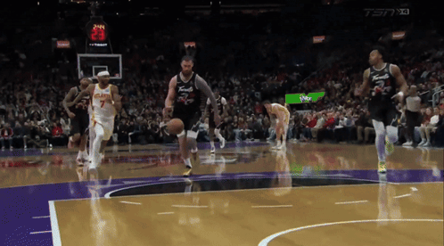 a basketball game is being played with a score of 23