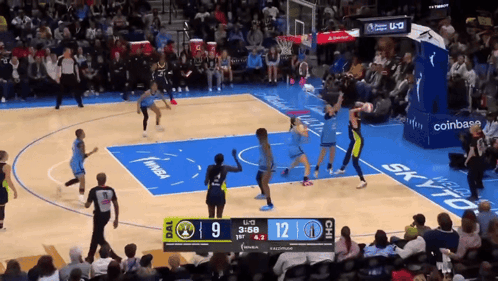 A Basketball Game Is Being Played With A Scoreboard Showing The Score At 12 To 9 GIF