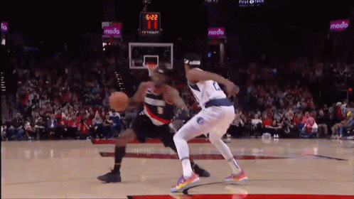 A Basketball Game Is Being Played With A Scoreboard That Says 5:22 GIF