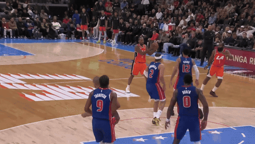 A Basketball Game Is Being Played With Players Number 9 And 12 GIF