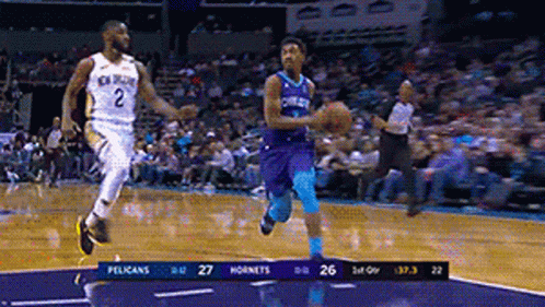 a basketball game is going on between the pelicans and the hornets