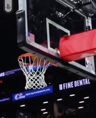 A Basketball Going Through A Net With A Fine Dental Sign Behind It GIF