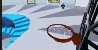 a basketball hoop is in the middle of a room with stairs .