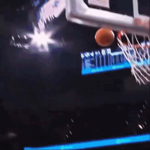 A Basketball Is Going Through A Hoop With A Sign That Says Miami On It GIF