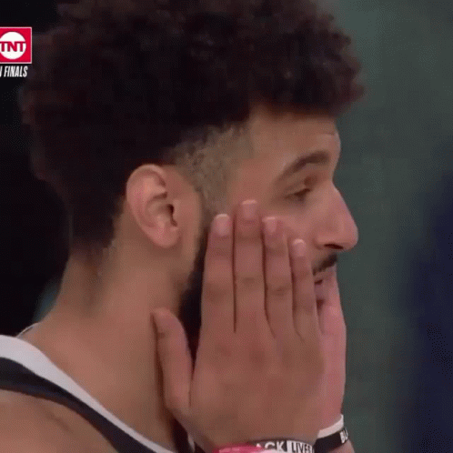 A Basketball Player Covering His Mouth With His Hands While Wearing A Wristband That Says " Black Lives Matter " GIF
