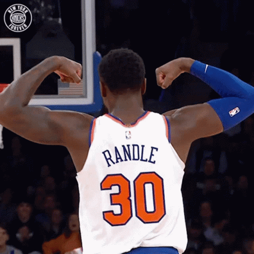 A Basketball Player Flexes His Muscles And Has The Number 30 On His Jersey GIF