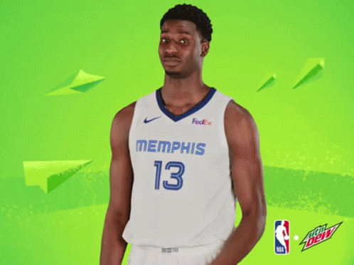 A Basketball Player For The Memphis Grizzlies Poses For A Picture GIF