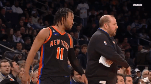 A Basketball Player For The New York Knicks Is Talking To His Coach GIF