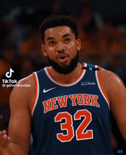 A Basketball Player For The New York Knicks Is Wearing A Blue Jersey With The Number 32 On It GIF
