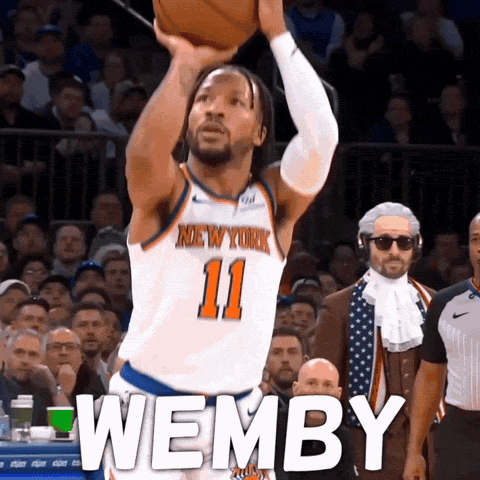 A Basketball Player For The New York Knicks Shoots A Ball GIF