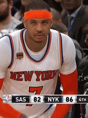 A Basketball Player For The New York Knicks Wears An Orange Headband During A Game GIF