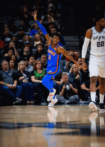 A Basketball Player For The Oklahoma City Thunder Jumps In The Air During A Game GIF