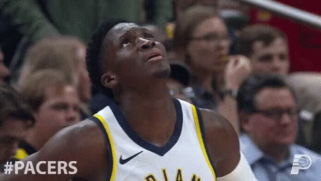 A Basketball Player For The Pacers Looks Up In The Air GIF