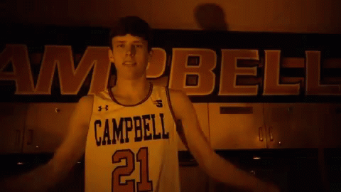 A Basketball Player From Campbell Flexes His Muscles GIF
