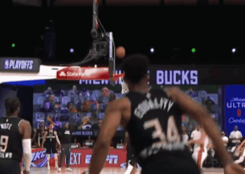 A Basketball Player In A Black Jersey With The Number 34 On It GIF
