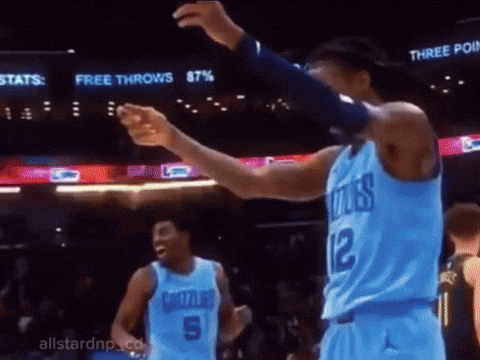 A Basketball Player In A Blue Jersey With The Number 12 On The Back GIF