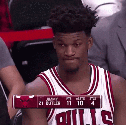A Basketball Player In A Bulls Jersey Is Sitting In The Stands Watching A Game . GIF