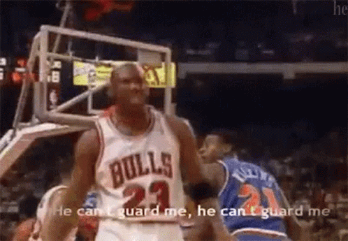 A Basketball Player In A Bulls Jersey Is Talking To Another Player . GIF