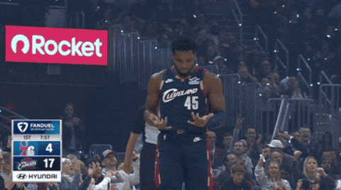 A Basketball Player In A Cleveland 45 Jersey Stands In Front Of A Crowd GIF