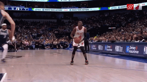 A Basketball Player In A Heat Jersey Stands On The Court GIF