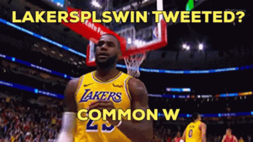 A Basketball Player In A Lakers Jersey Stands In Front Of A Basketball Hoop GIF