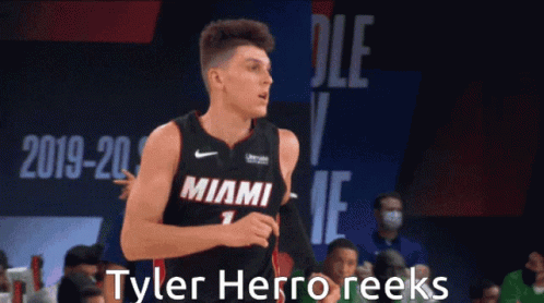 A Basketball Player In A Miami Jersey Is Running GIF