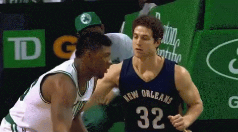 A Basketball Player In A New Orleans Jersey Is Talking To Another Player GIF