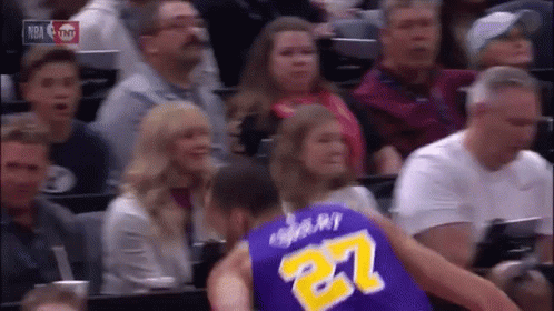 A Basketball Player In A Purple Jersey With The Number 27 On The Back GIF