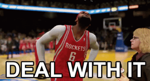 A Basketball Player In A Red Rockets Jersey Is Being Interviewed By A Woman GIF