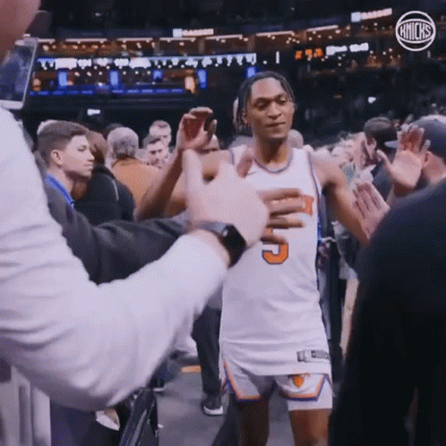 A Basketball Player In A White Jersey With The Number 5 On It GIF