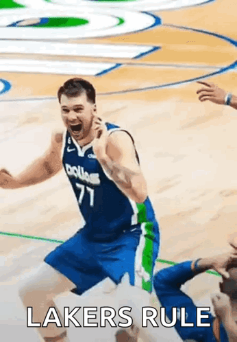 A Basketball Player Is Celebrating On The Court With The Words Lakers Rule Written On The Bottom . GIF